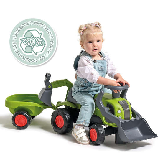 FALK Baby Claas-ajotraktori, jossa on kaivinkoneen kauha ja perävaunu.
