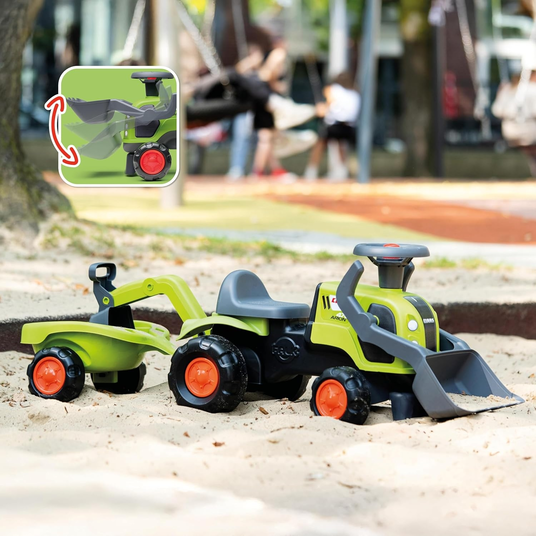FALK Baby Claas-ajotraktori, jossa on kaivinkoneen kauha ja perävaunu.
